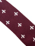 maroon knitted tie with white embroidered fleur de lis lys design